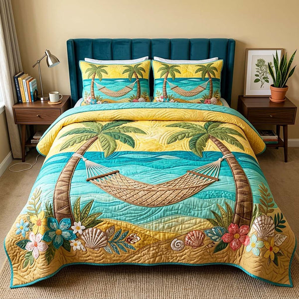 Palm Hammock Sunset quilted 3-piece bedding set on a made bed in a light coastal bedroom
