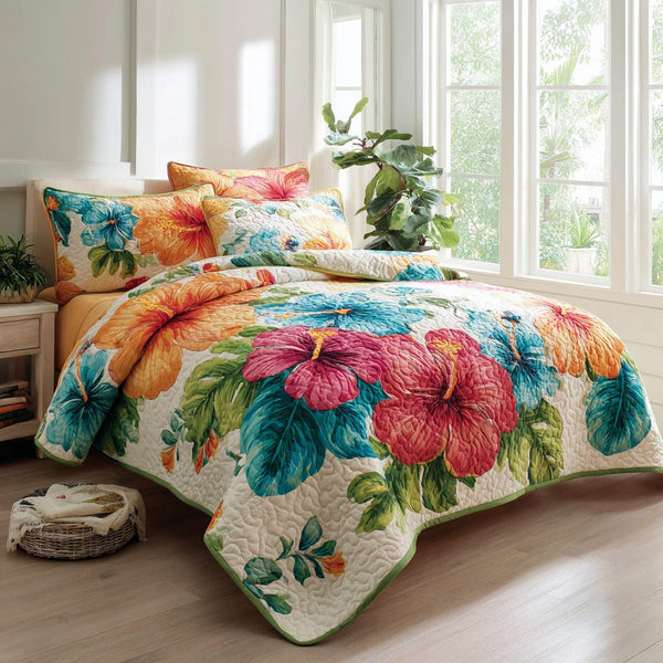 Paradise Bloom quilted 3-piece bedding set on a made bed with two matching pillow shams