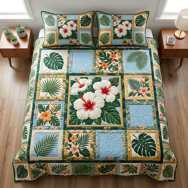 Paradise Hibiscus quilted 3-piece bedding set on a made bed with two matching pillow shams