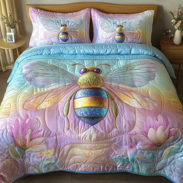 Pastel Dream Bee quilted 3-piece bedding set on a made bed with two matching pillow shams