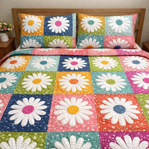 Pastel Garden quilted 3-piece bedding set on a made bed with two matching pillow shams
