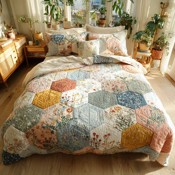 Pastel Petals quilted 3-piece bedding set on a made bed with two matching pillow shams
