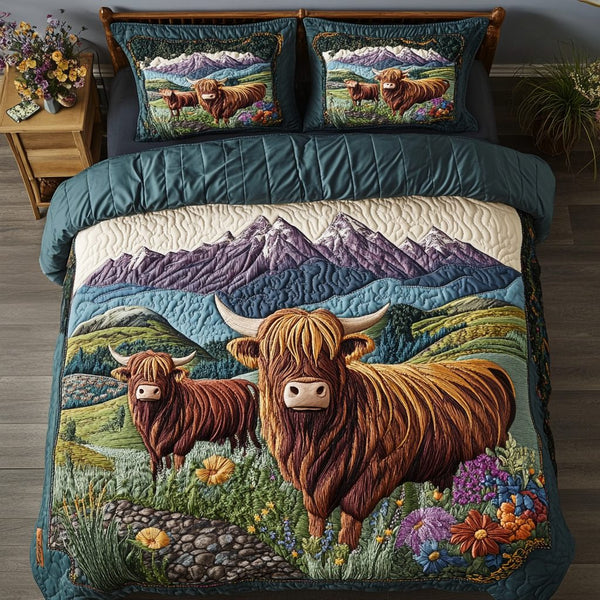 Pastoral Dreams quilted 3-piece bedding set on a made bed with two matching pillow shams