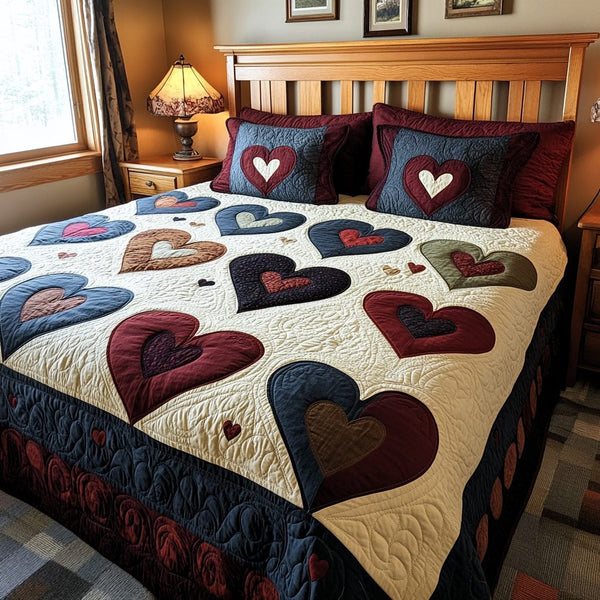 Patch of Hearts quilted 3-piece bedding set on a made bed with two matching pillow shams