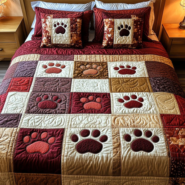 Patch Paws quilted 3-piece bedding set on a made bed with two matching pillow shams