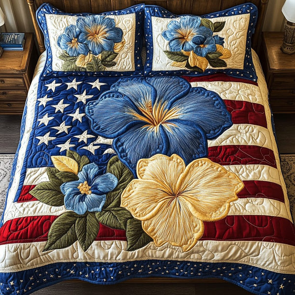 Patch Petals quilted 3-piece bedding set on a made bed with two matching pillow shams