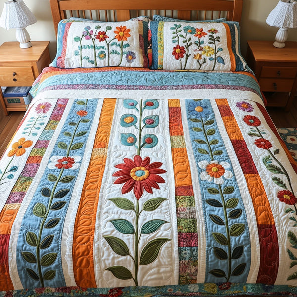 Patchwork Blooming Meadow quilted 3-piece bedding set on a made bed in a farmhouse bedroom