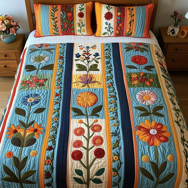 Patchwork Blooming Meadow quilted 3-piece bedding set on a made bed in a farmhouse bedroom