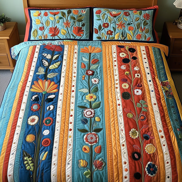 Patchwork Blooming Meadow quilted 3-piece bedding set on a made bed in a farmhouse bedroom