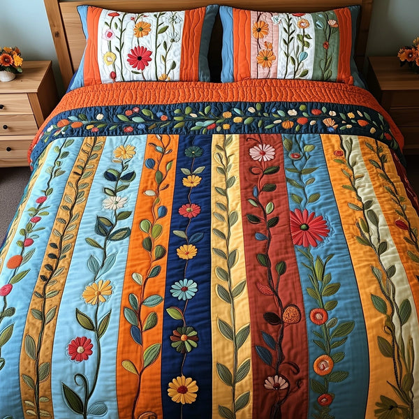 Patchwork Blooming Meadow quilted 3-piece bedding set on a made bed in a farmhouse bedroom