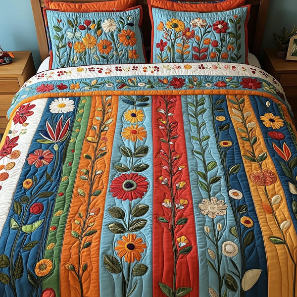 Patchwork Blooming Meadow quilted 3-piece bedding set on a made bed in a farmhouse bedroom