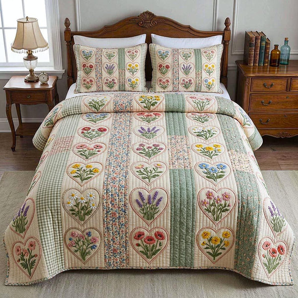 Patchwork Garden quilted 3-piece bedding set on a made bed in a farmhouse bedroom