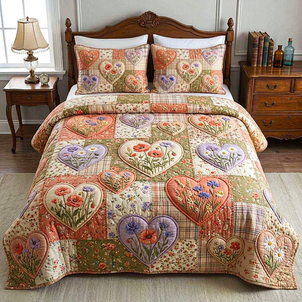 Patchwork Garden quilted 3-piece bedding set on a made bed in a farmhouse bedroom