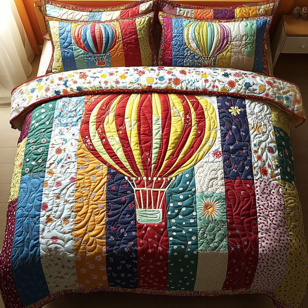 Patchwork Voyage quilted 3-piece bedding set on a made bed in a farmhouse bedroom