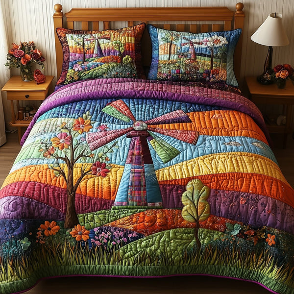 Patchwork Windmill quilted 3-piece bedding set on a made bed in a farmhouse bedroom