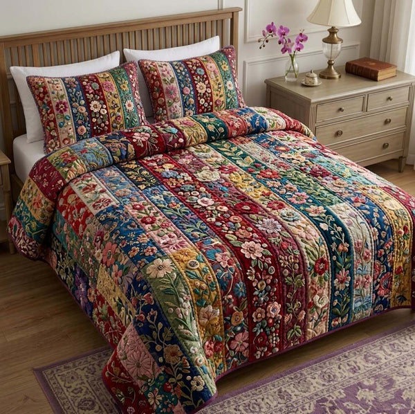 Patchy Bloom quilted 3-piece bedding set on a made bed with two matching pillow shams