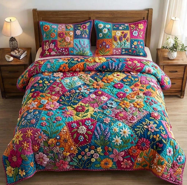 Patchy Bloom quilted 3-piece bedding set on a made bed with two matching pillow shams