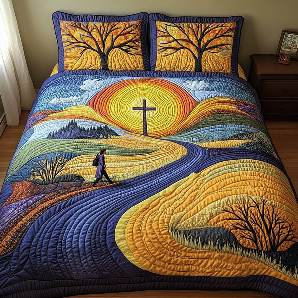 Path of Grace quilted 3-piece bedding set on a made bed with two matching pillow shams