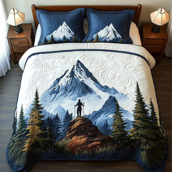 Pathfinder quilted 3-piece bedding set on a made bed with two matching pillow shams
