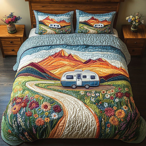 Pathfinder Road quilted 3-piece bedding set on a made bed with two matching pillow shams
