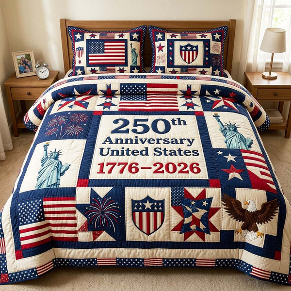 Patriot Anniversary quilted 3-piece bedding set on a made bed in a warmly lit bedroom