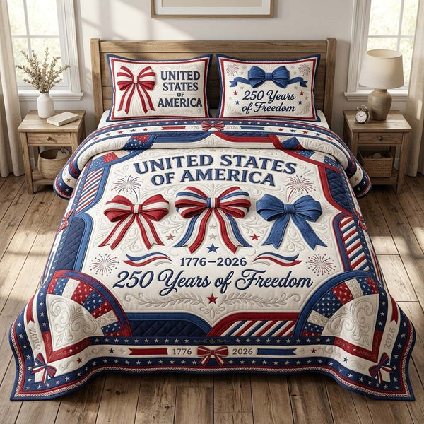 Patriot Charm quilted 3-piece bedding set on a made bed in a warmly lit bedroom