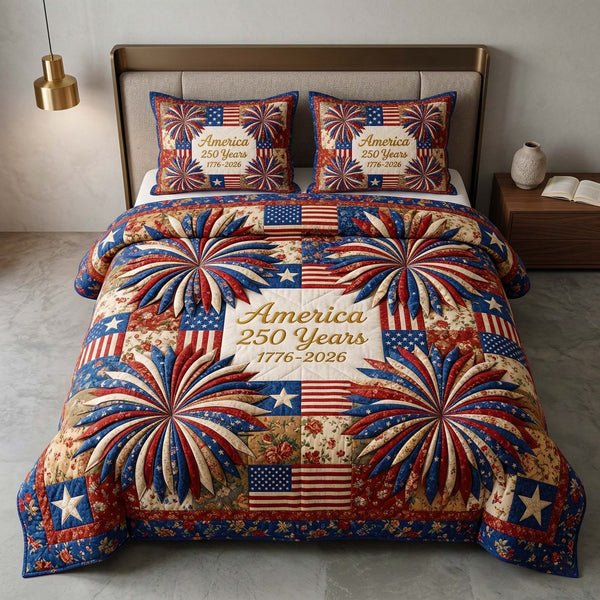 Patriot Fireworks quilted 3-piece bedding set on a made bed in a warmly lit bedroom