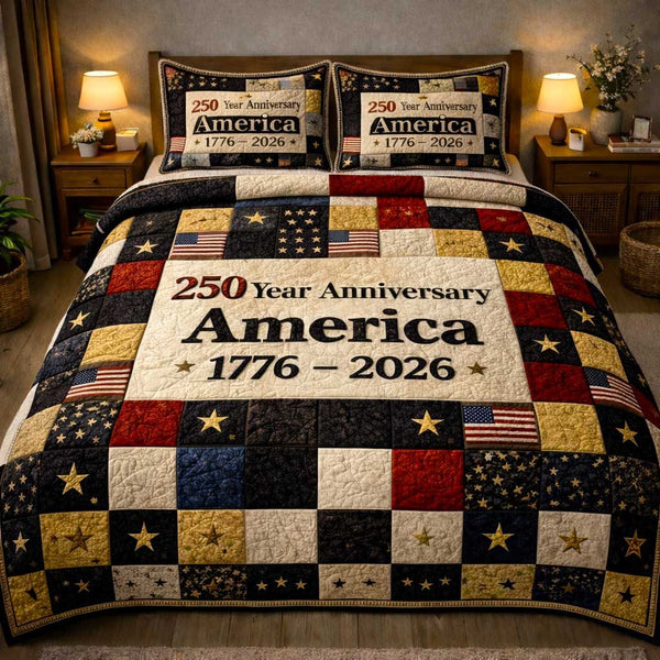 Patriot Glory quilted 3-piece bedding set on a made bed in a warmly lit bedroom