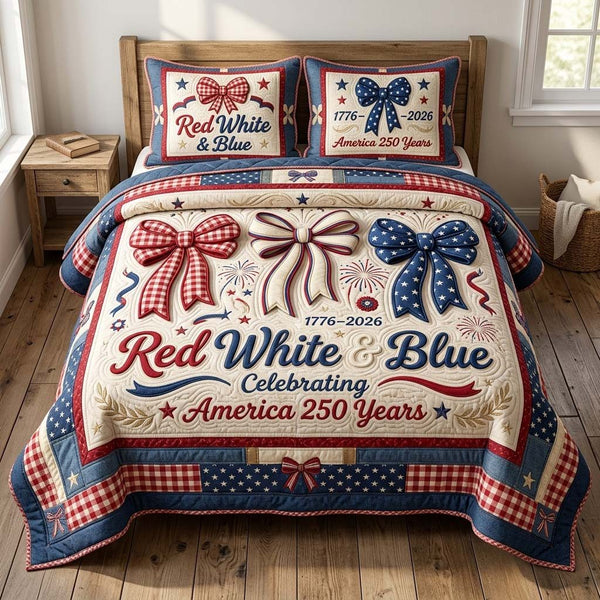Patriot Ribbons quilted 3-piece bedding set on a made bed in a warmly lit bedroom