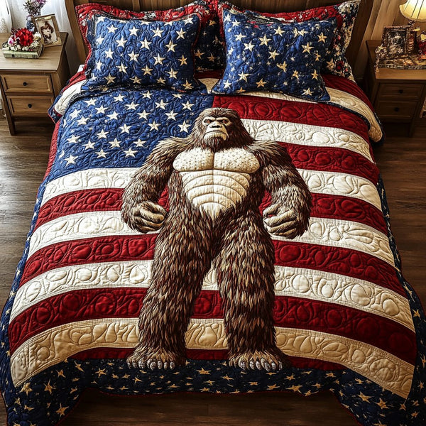 Patriot Sasquatch quilted 3-piece bedding set on a made bed in a warmly lit bedroom