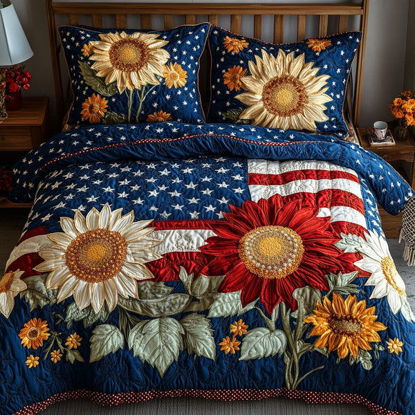Patriotic Bloom quilted 3-piece bedding set on a made bed in a warmly lit bedroom