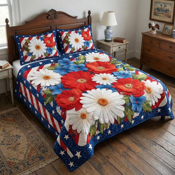 Patriotic Blooms quilted 3-piece bedding set on a made bed in a warmly lit bedroom