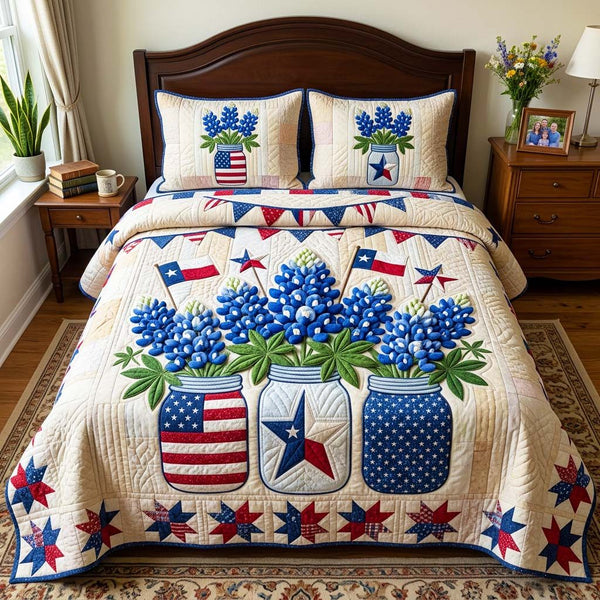 Patriotic Bluebonnet quilted 3-piece bedding set on a made bed in a warmly lit bedroom