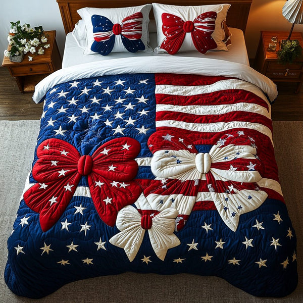 Patriotic Charm quilted 3-piece bedding set on a made bed in a warmly lit bedroom