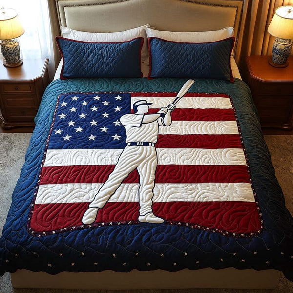 Patriotic Home Run quilted 3-piece bedding set on a made bed in a warmly lit bedroom