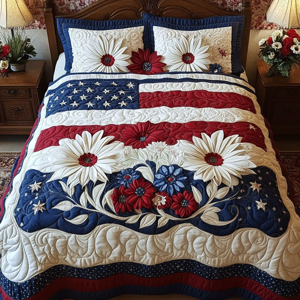 Patriotic Petals quilted 3-piece bedding set on a made bed in a warmly lit bedroom