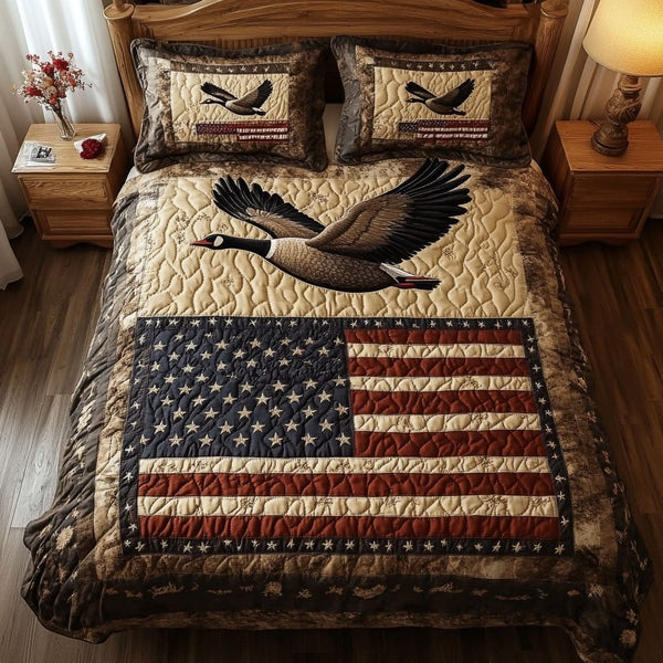Patriotic Wings quilted 3-piece bedding set on a made bed in a warmly lit bedroom