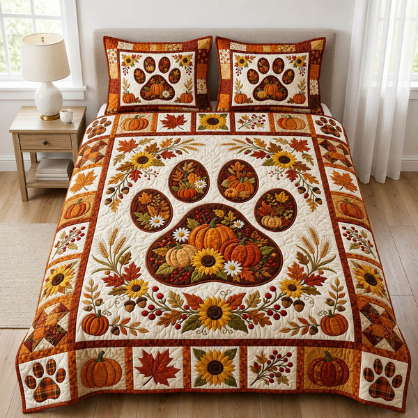 Paw Print quilted 3-piece bedding set on a made bed with two matching pillow shams