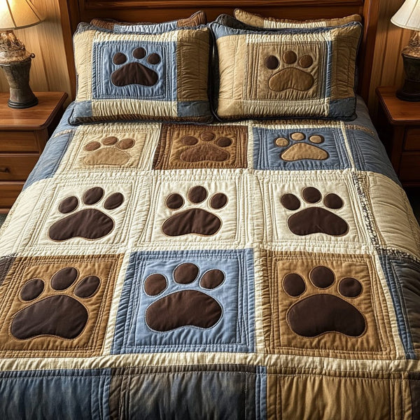Paw Prints quilted 3-piece bedding set on a made bed with two matching pillow shams