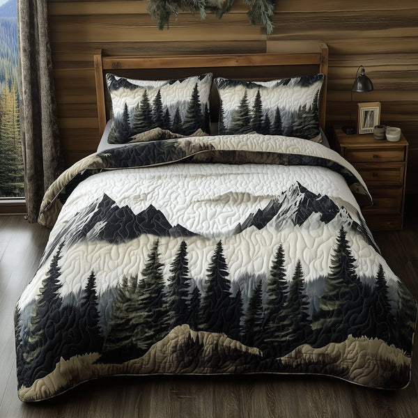 Peaceful Mountain Forest quilted 3-piece bedding set on a made bed with two matching pillow shams