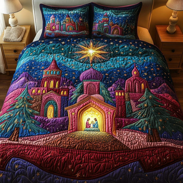 Peaceful Serenity quilted 3-piece bedding set on a made bed with two matching pillow shams