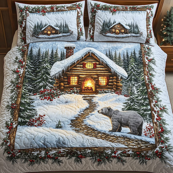 Peaceful Snow Cabin quilted 3-piece bedding set on a made bed with two matching pillow shams