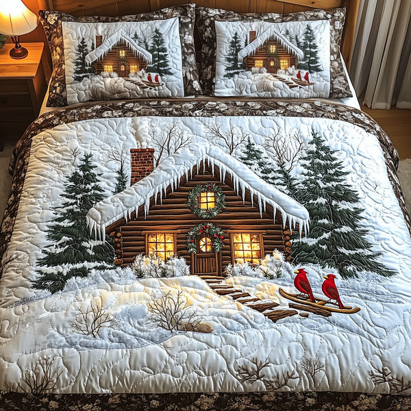 Peaceful Snow Cabin quilted 3-piece bedding set on a made bed with two matching pillow shams