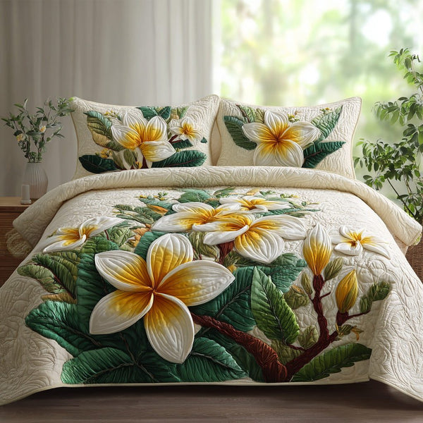 Pearl Lei quilted 3-piece bedding set on a made bed with two matching pillow shams