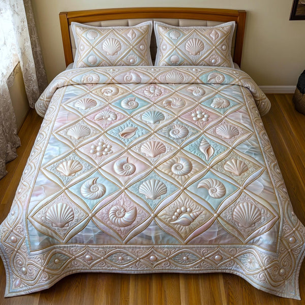 Pearl Ocean quilted 3-piece bedding set on a made bed in a light coastal bedroom