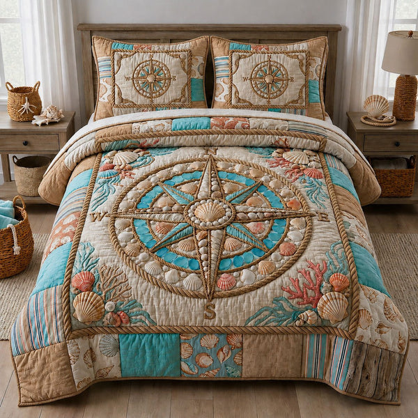Pearl Seashell Compass quilted 3-piece bedding set on a made bed in a light coastal bedroom