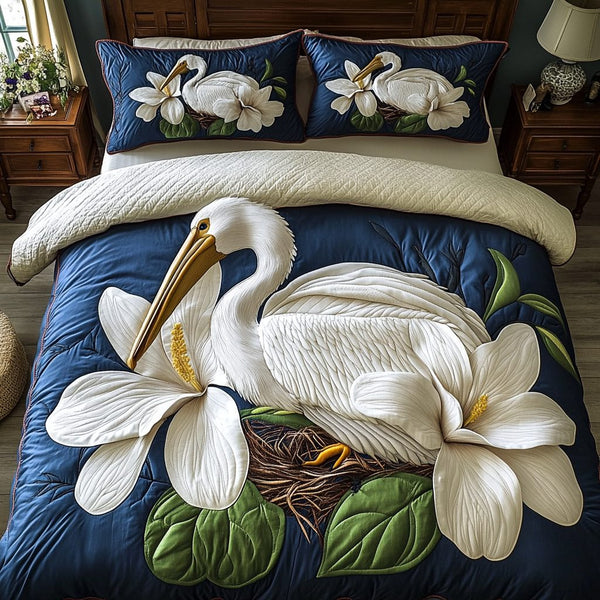 Pelican Blossom quilted 3-piece bedding set on a made bed with two matching pillow shams