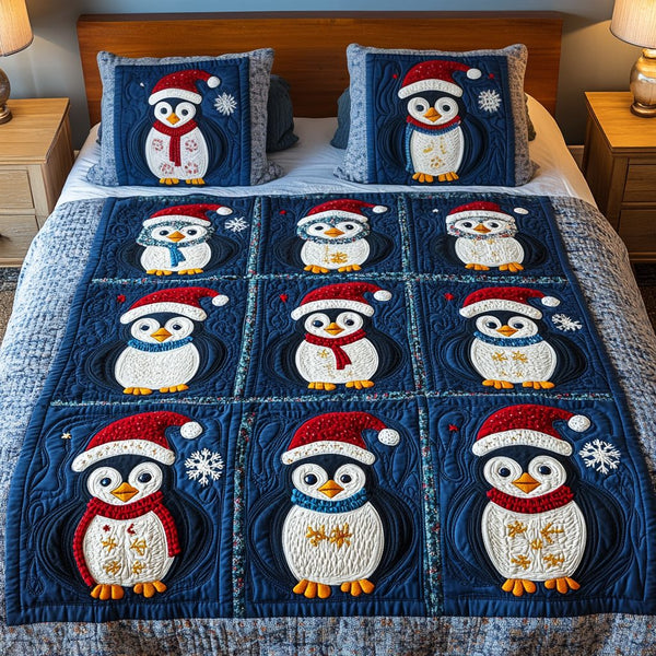 Penguin Patch quilted 3-piece bedding set on a made bed with two matching pillow shams