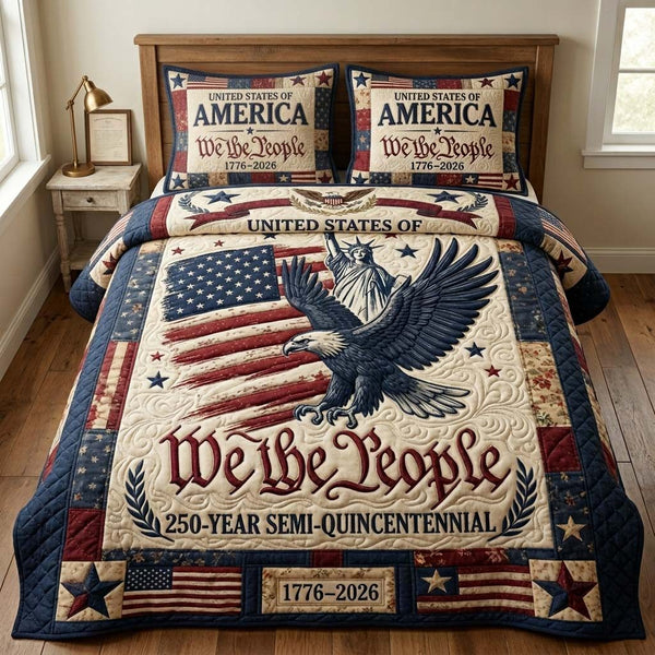 People Liberty quilted 3-piece bedding set on a made bed in a warmly lit bedroom