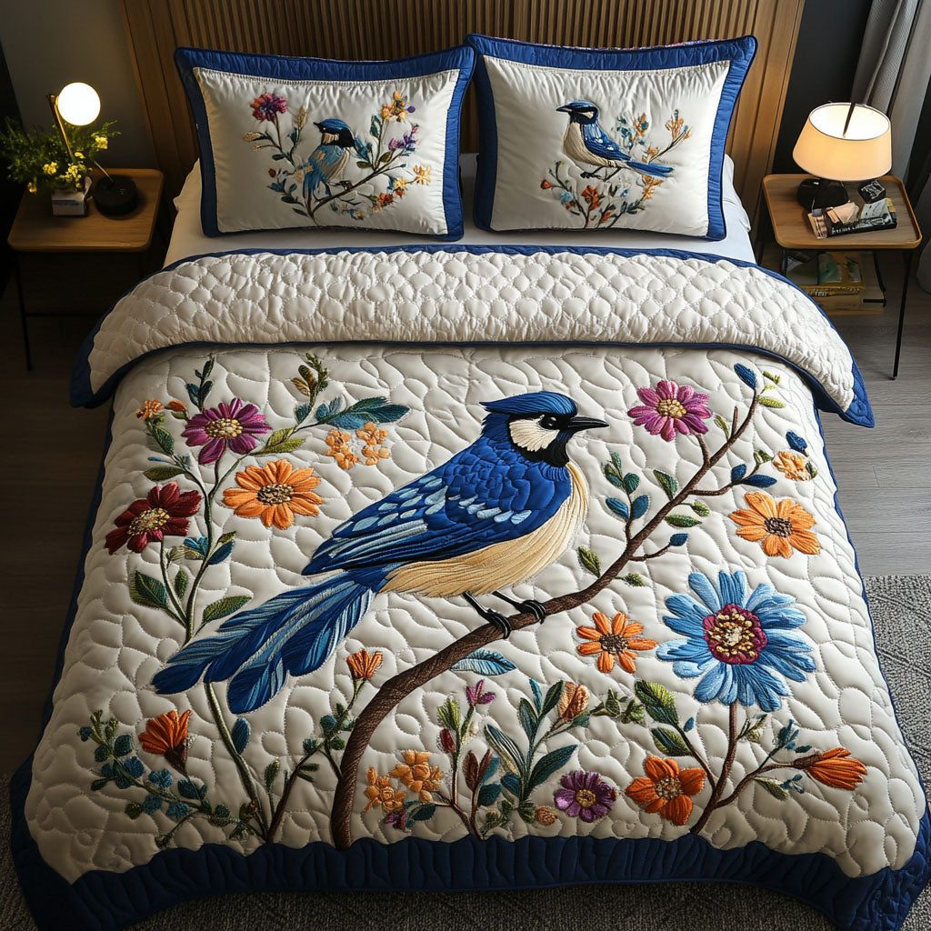 Perch and Petals quilted 3-piece bedding set on a made bed with two matching pillow shams